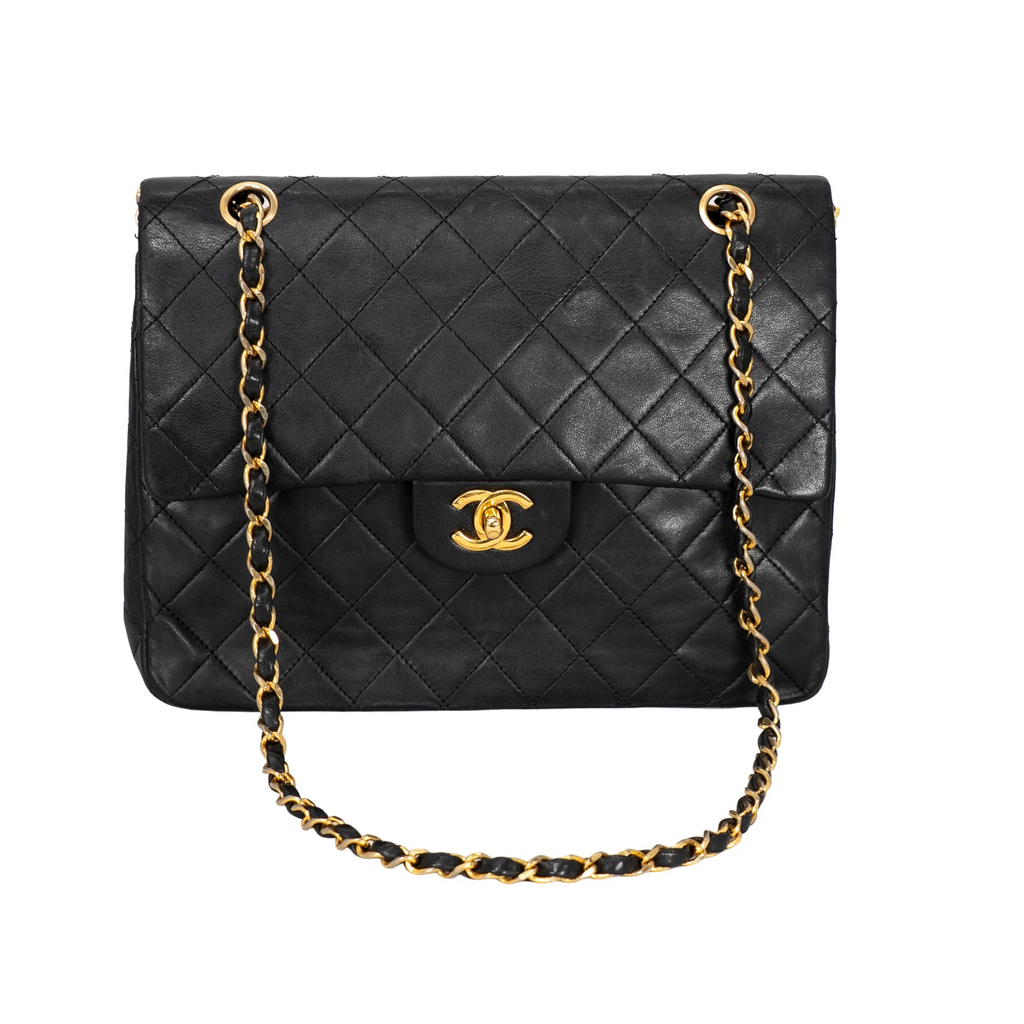 Your Bag Now Mine Chanel black quilted leather trapezoid shoulder bag with gold-tone CC turn-lock and chain strap.