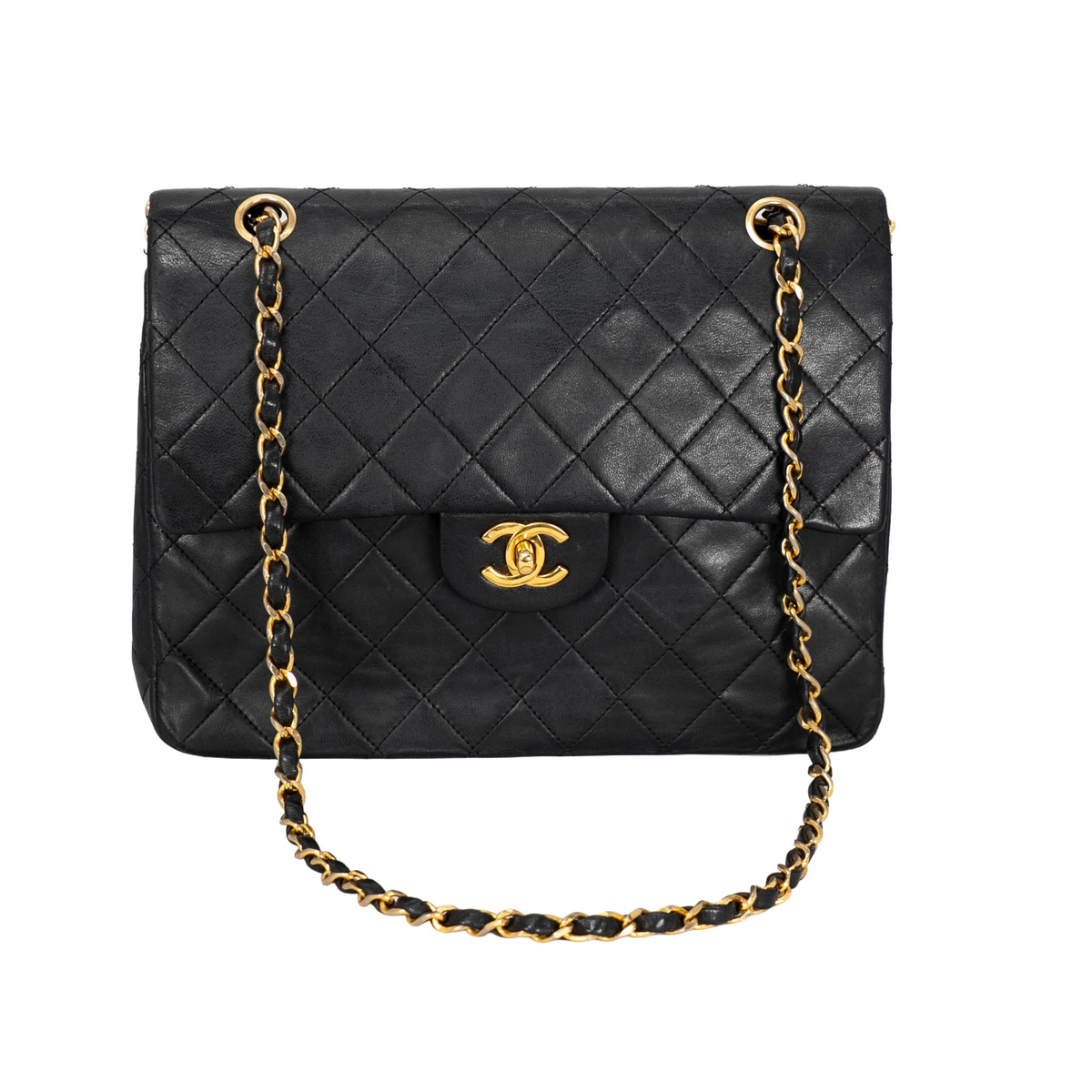 Your Bag Now Mine Chanel black quilted leather trapezoid shoulder bag with gold-tone CC turn-lock and chain strap.