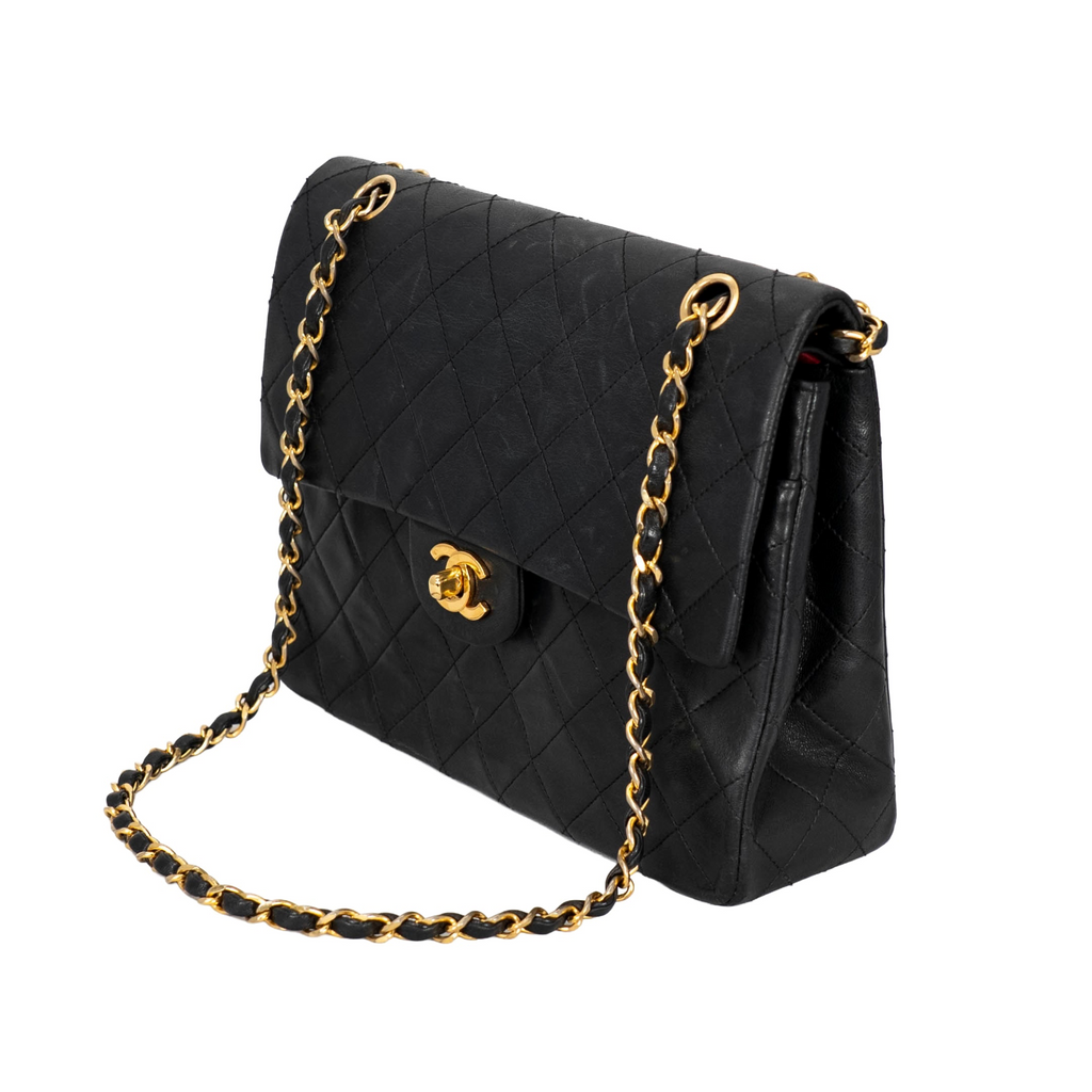 Your Bag Now Mine Chanel black quilted leather trapezoid shoulder bag with gold-tone chain strap and CC turn-lock