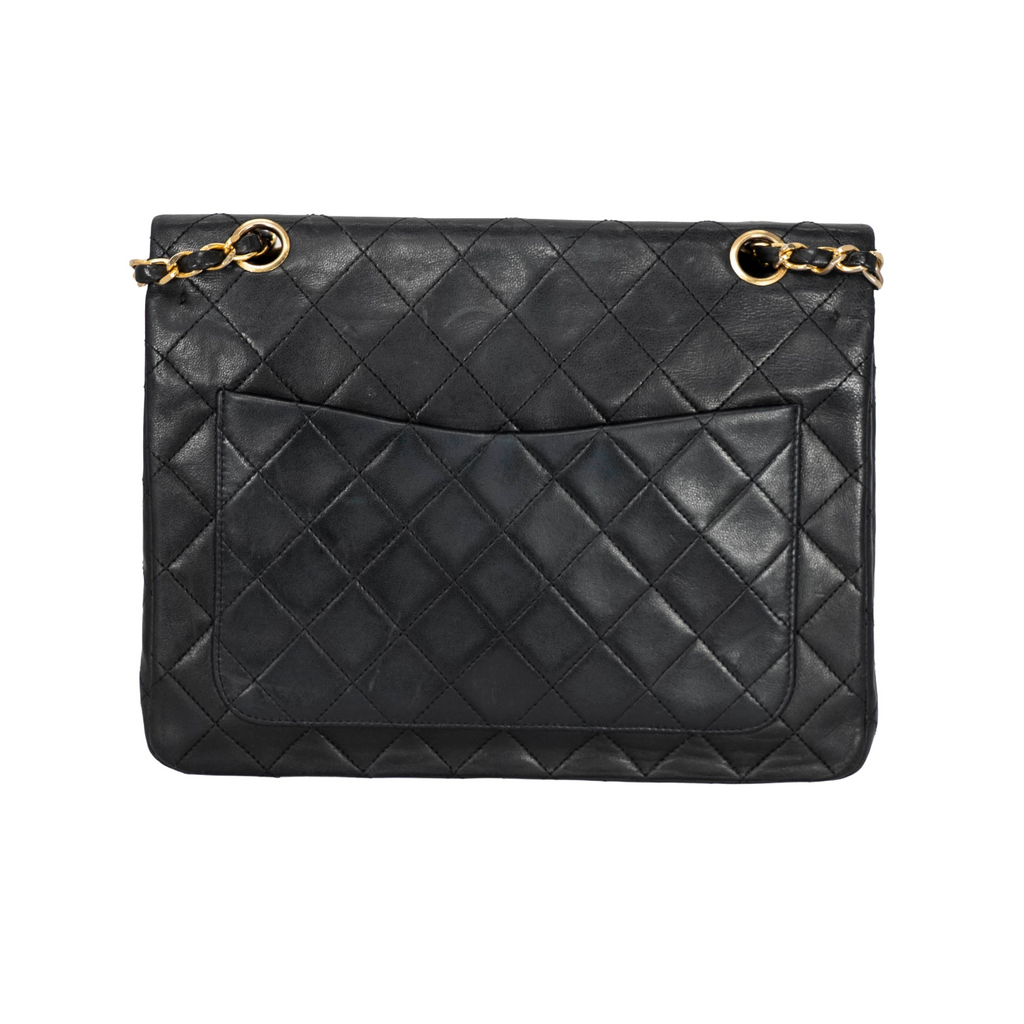 Your Bag Now Mine Chanel black quilted leather trapezoid shoulder bag with gold-tone chain strap and back pocket