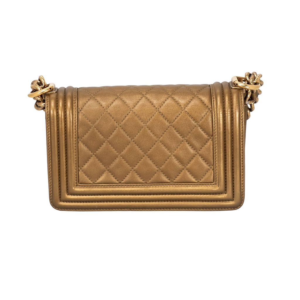 Back view of Chanel Boy Flap Bag in metallic bronze/gold quilted leather featuring aged or antique gold-tone hardware