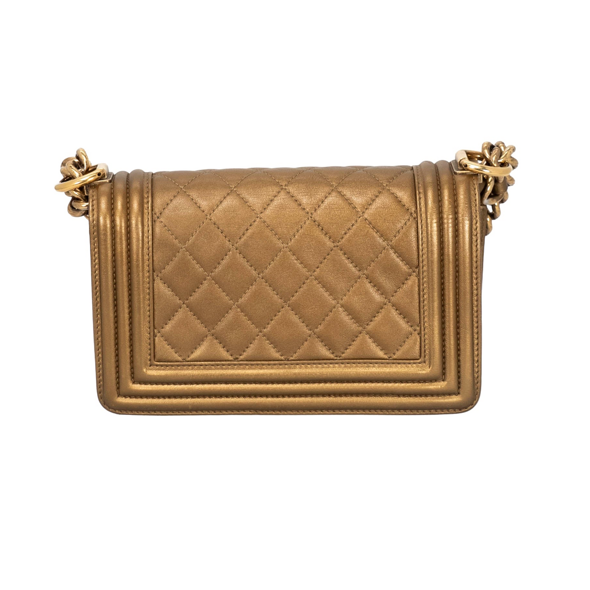 Back view of Chanel Boy Flap Bag in metallic bronze/gold quilted leather featuring aged or antique gold-tone hardware