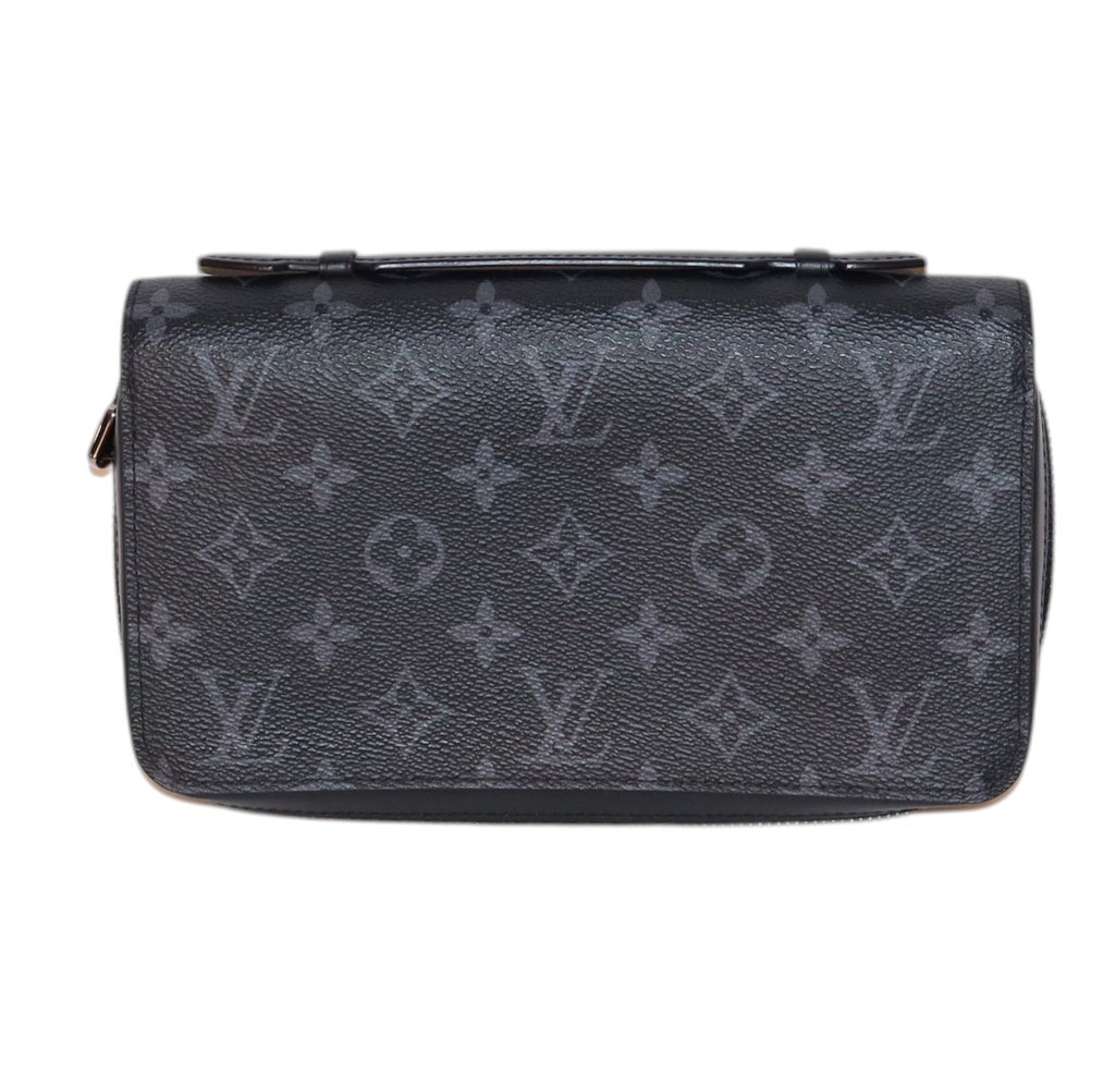 back view Louis Vuitton monogram canvas zip-around wallet in dark gray, featuring the classic embossed LV and floral motifs on a clean white background.
