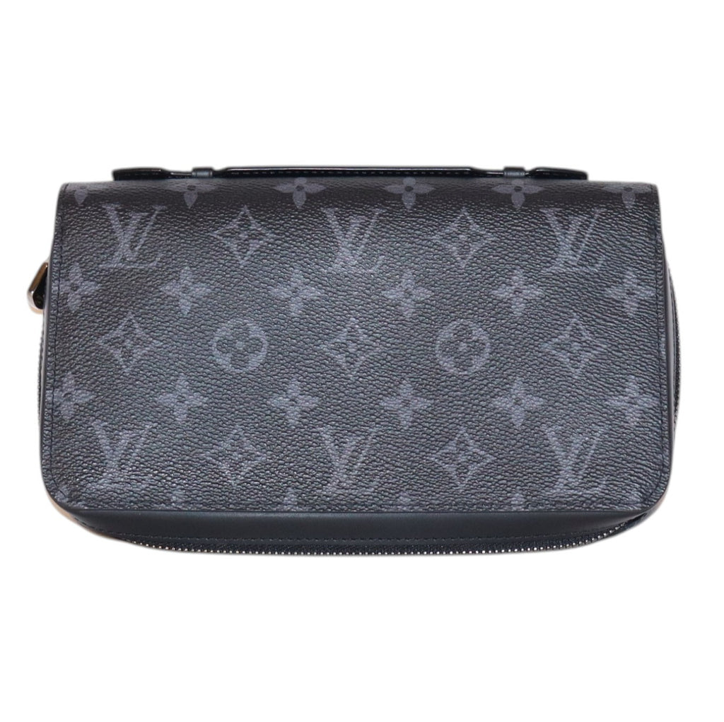 front view Louis Vuitton dark gray monogram canvas xl wallet with a top zipper closure, shown against a plain white background.