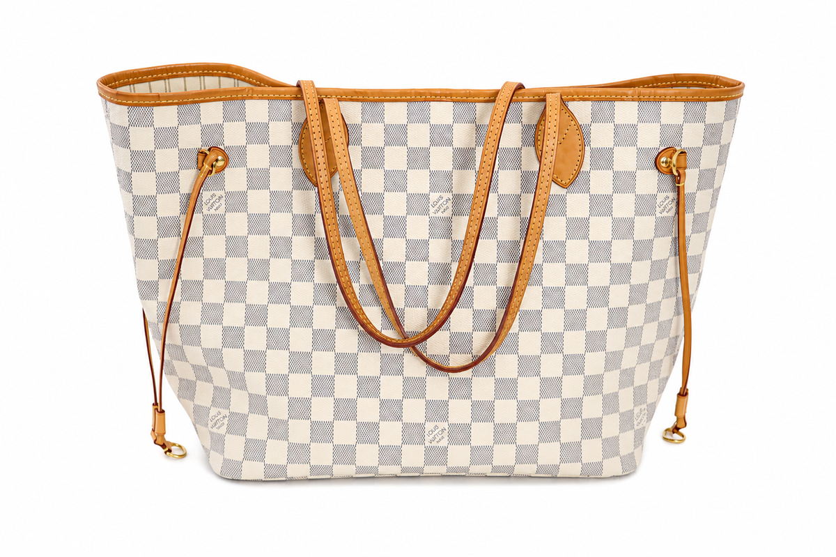 A Louis Vuitton Neverfull tote bag in Damier Azur canvas, featuring a light gray and off-white checkered pattern with tan leather trim, handles, and side straps, shown against a plain white background.