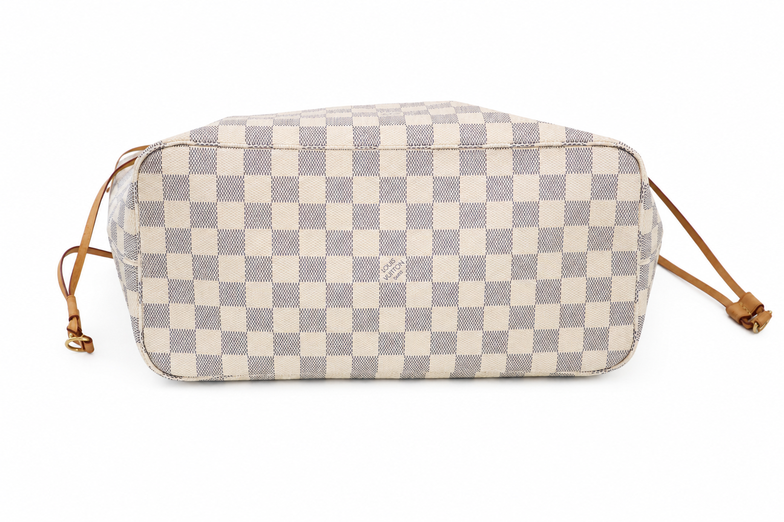 Bottom of a Louis Vuitton tote with a light beige and blue-gray checkerboard pattern and tan leather strap details, shown on a plain white background.