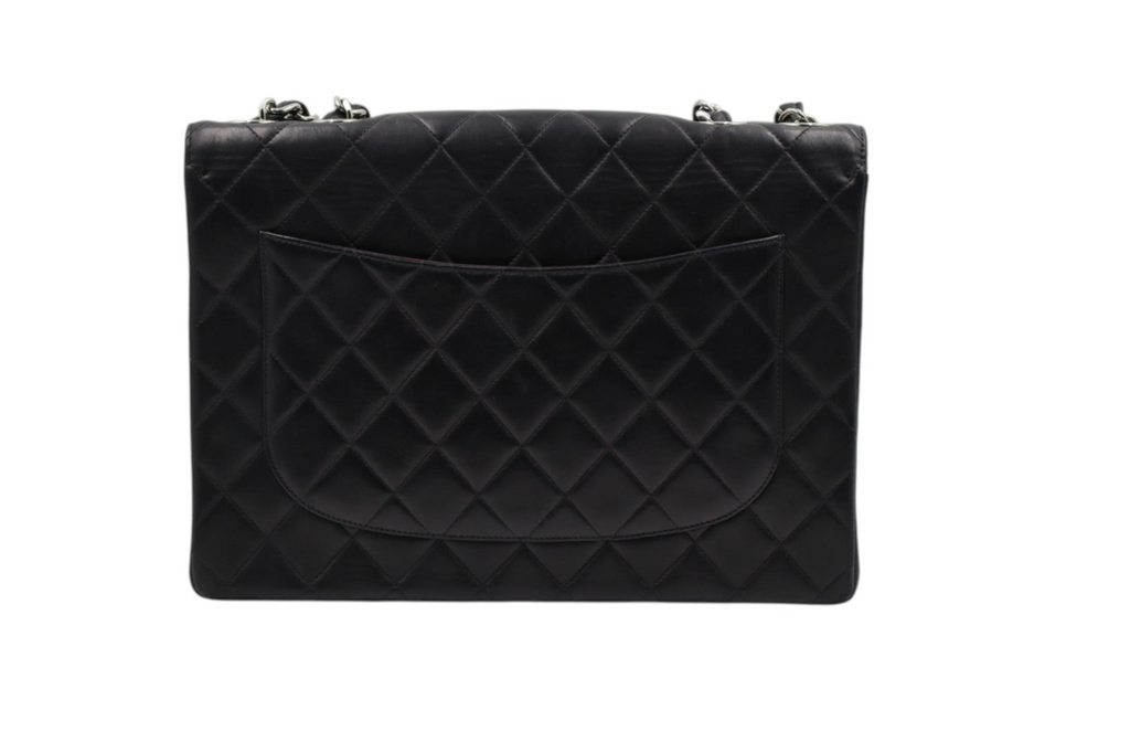 back view Chanel black quilted leather clutch bag with silver-tone chain strap hardware.