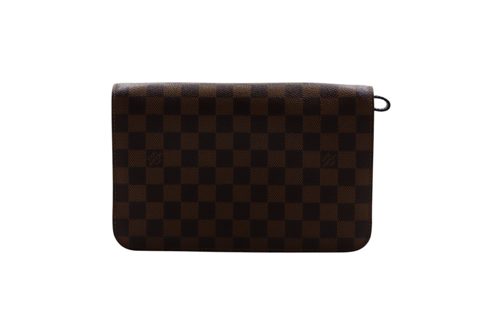 back view of a Louis Vuitton brown and black checkered clutch bag with a small black ring detail on the right side.