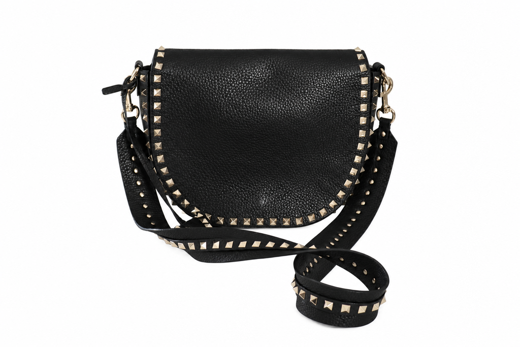 A Valentino black pebbled leather crossbody bag with gold-tone studs and hardware, shown on a plain white background.