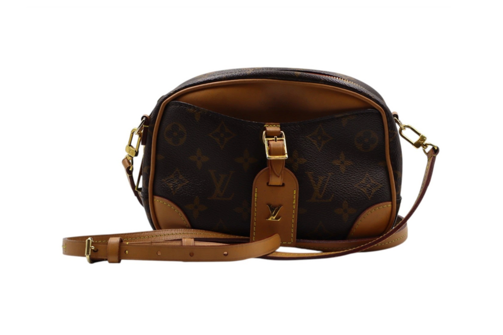 front view Louis Vuitton monogram canvas shoulder bag with tan leather trim and strap, featuring a front leather tab with a gold-tone LV logo.