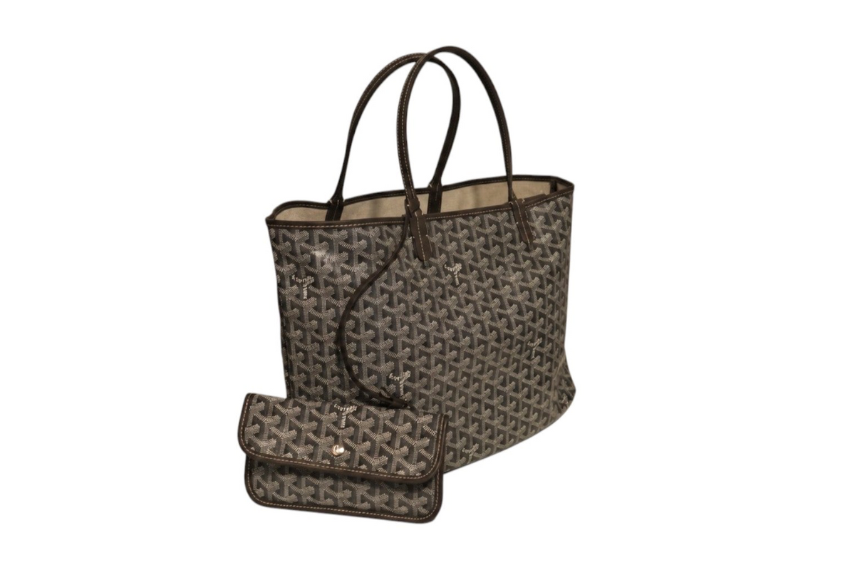 Angled front view of Goyard Saint Louis tote bag in gray and black Goyardine canvas with dark leather shoulder handles and matching detachable pouch on a white background.