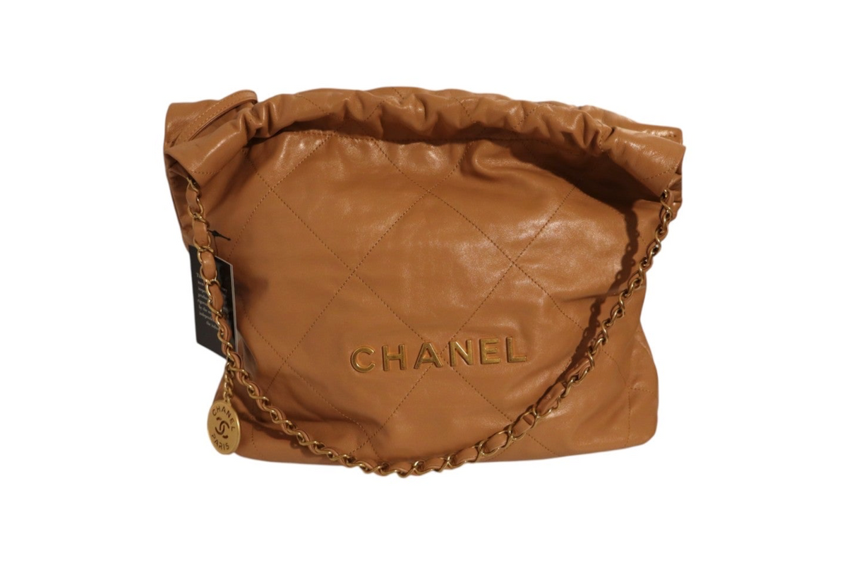 Front view of Chanel tan quilted leather shoulder bag with gold-tone CHANEL lettering, chain strap, and ruched top