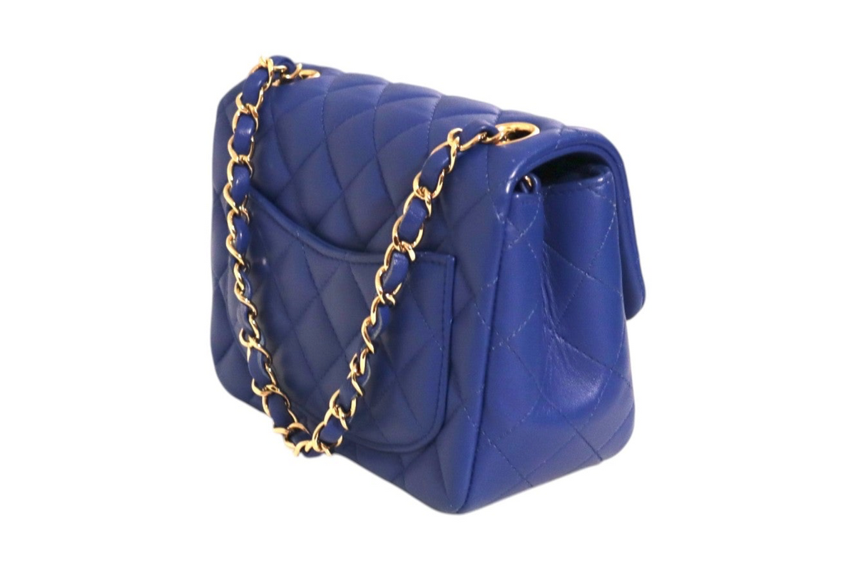 Chanel electric blue quilted leather mini classic shoulder bag with gold-tone chain strap angled view