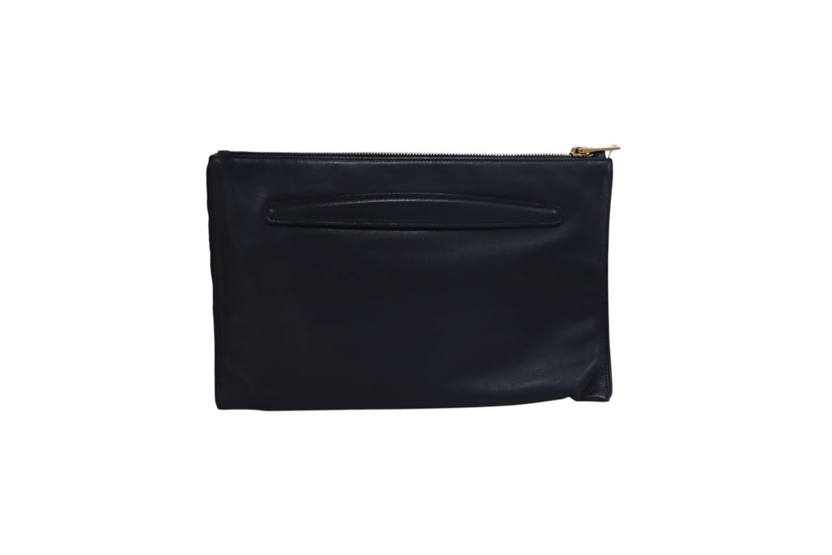 back view of a black leather Miu Miu clutch pouch with a gold zipper pull, shown against a plain white background.