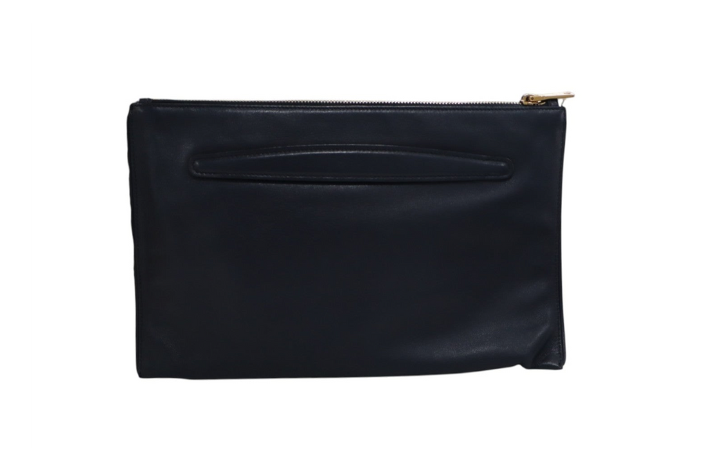back view of a black leather Miu Miu clutch pouch with a gold zipper pull.