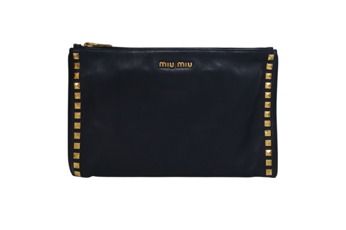 front view black leather Miu Miu zip-around pouch with gold-tone studs along the edges and a gold logo on the front.