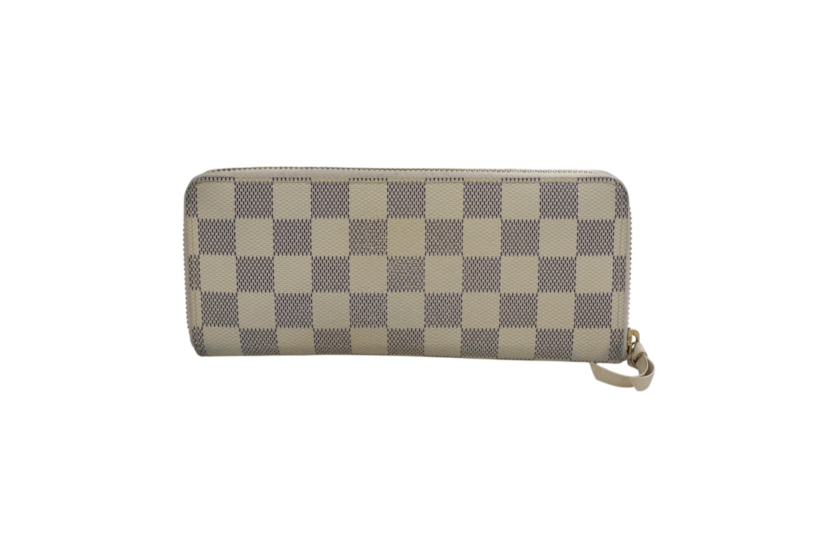 back view louis vuitton long zip-around wallet with a beige and gray checkerboard pattern, featuring a small matching wristlet strap on the right side, shown against a plain white background.