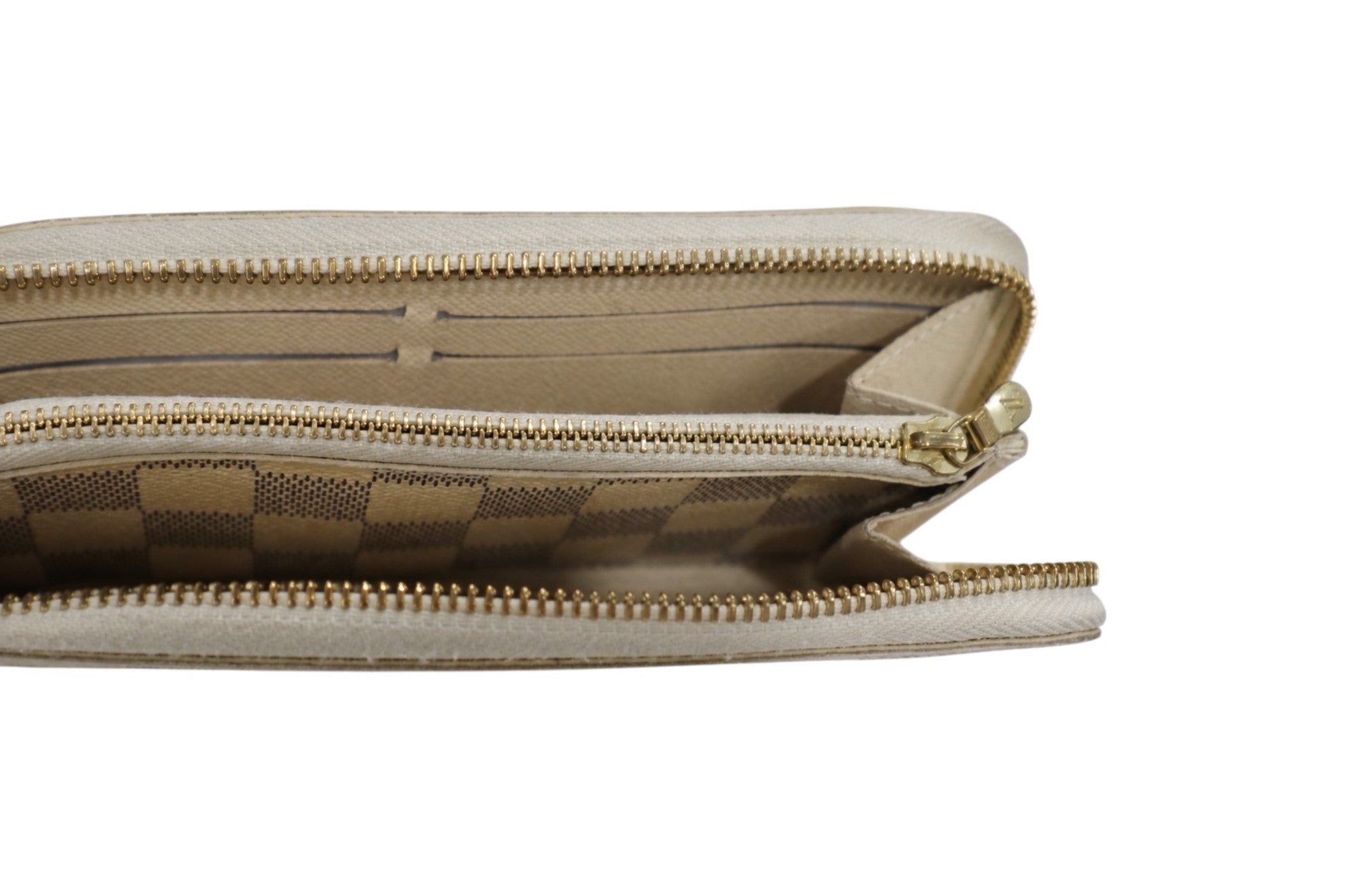 inside view of louis vuitton  wallet with beige leather zip-around wallet with gold-tone zippers and a subtle checkered pattern lining, shown against a plain white background.