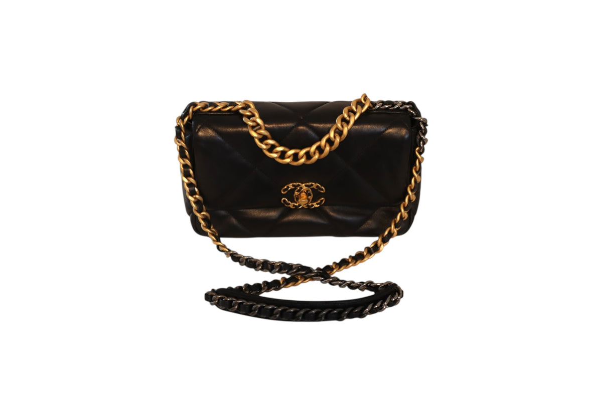 A black quilted Chanel leather flap bag with gold-tone chain straps and a gold interlocking CC logo on the front.