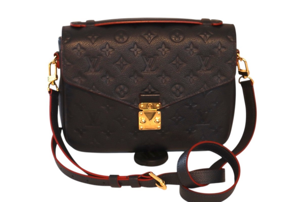 A Louis Vuitton Monogram Pallas shoulder bag in navy leather with gold-tone hardware.