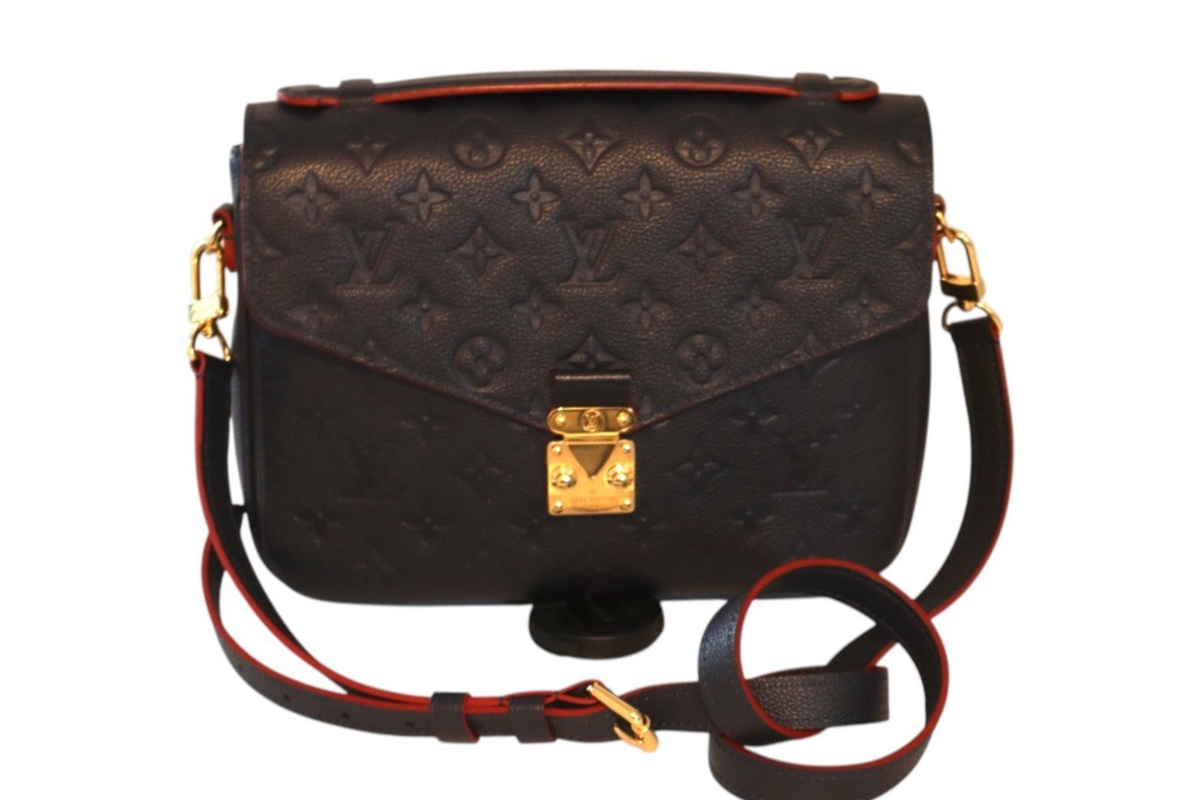 A Louis Vuitton Monogram Pallas shoulder bag in navy leather with gold-tone hardware.
