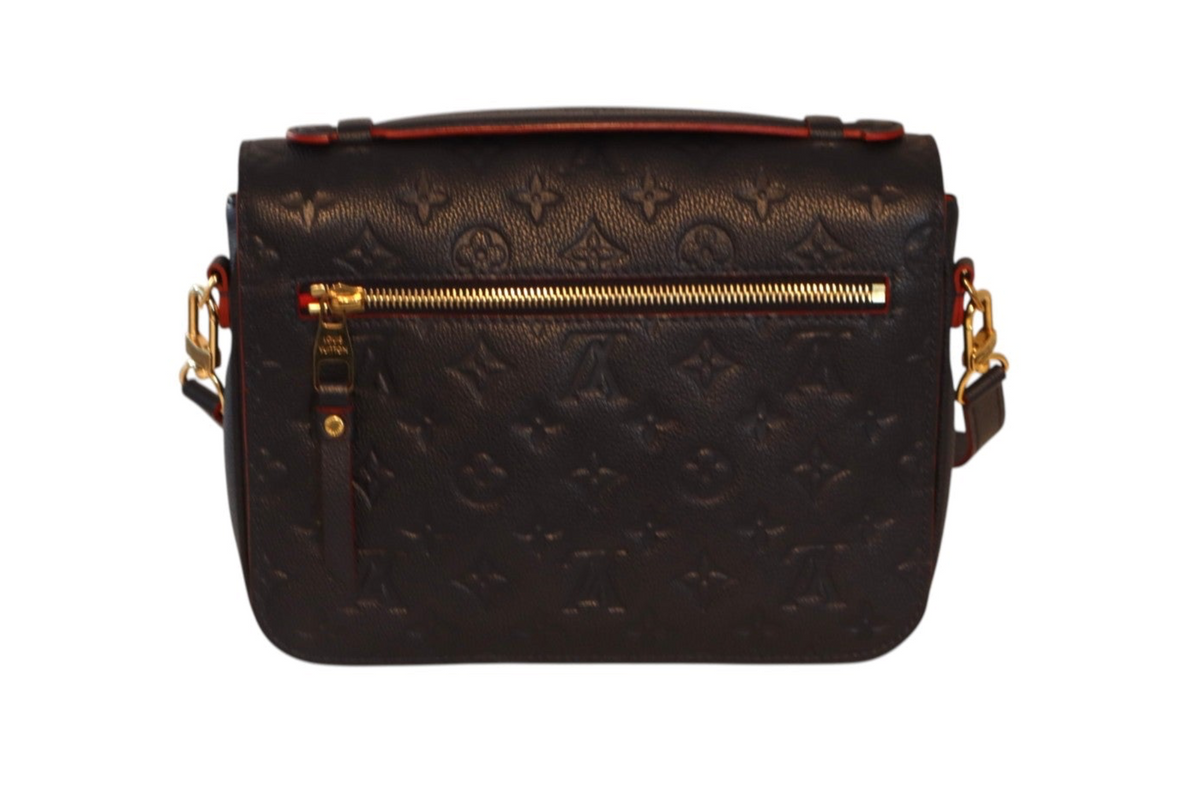 A navy leather Louis Vuitton monogram shoulder bag with gold-tone hardware.