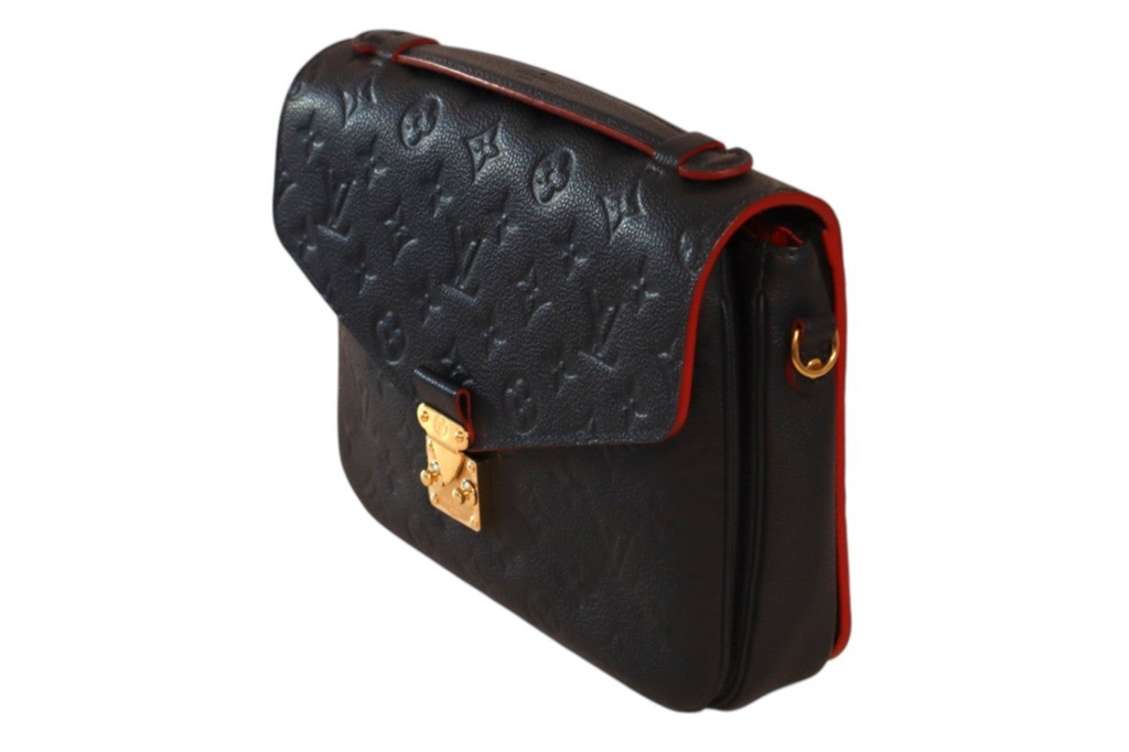 A navy leather Louis Vuitton shoulder bag featuring the brand's signature monogram pattern on the flap, black leather body, and a thin red piping accent along the edges, with gold-tone hardware.