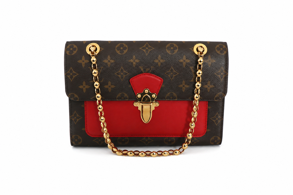 A Louis Vuitton shoulder bag in brown monogram canvas with a vibrant red leather front panel and a gold-tone chain strap, shown against a plain white background.