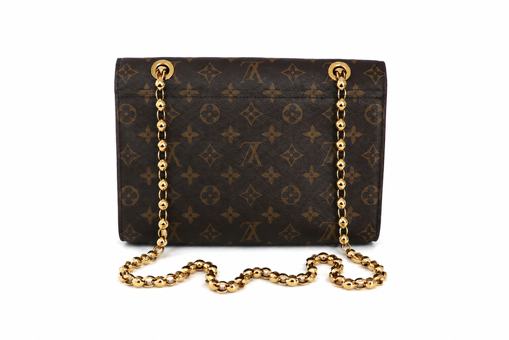 A Louis Vuitton monogram canvas shoulder bag in dark brown with gold-tone chain strap and gold hardware, shown against a plain white background.